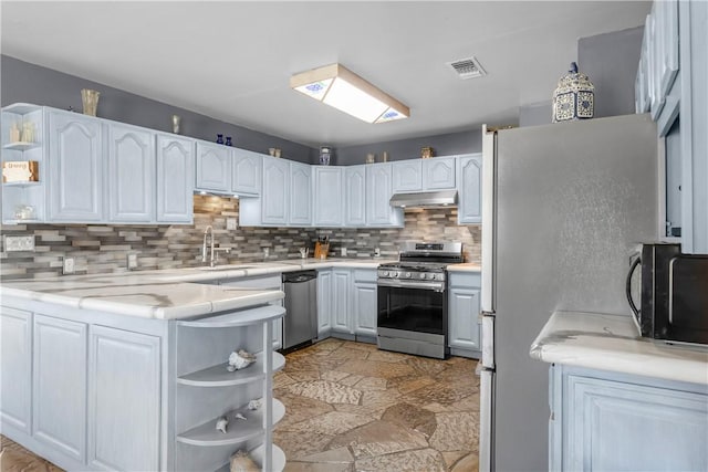 kitchen with stainless steel appliances and white cabinetry