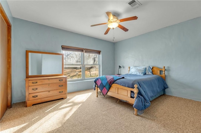 bedroom featuring ceiling fan and carpet floors