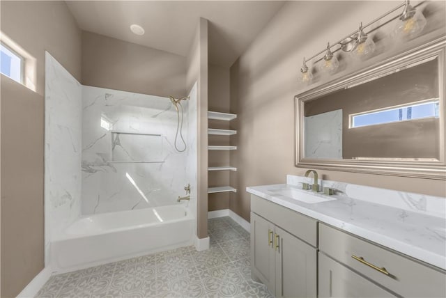 bathroom with washtub / shower combination, vanity, and tile patterned flooring