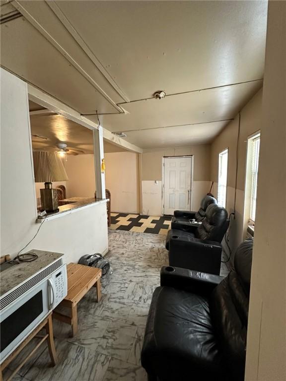 basement with ceiling fan