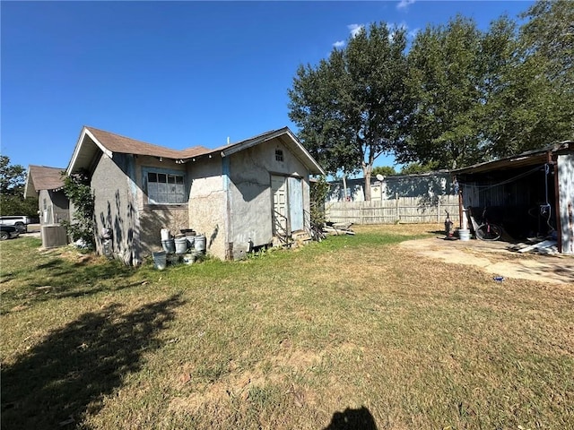 exterior space with a yard and an outdoor structure