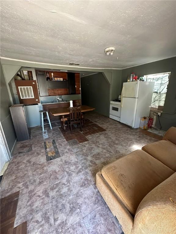 living room featuring a textured ceiling