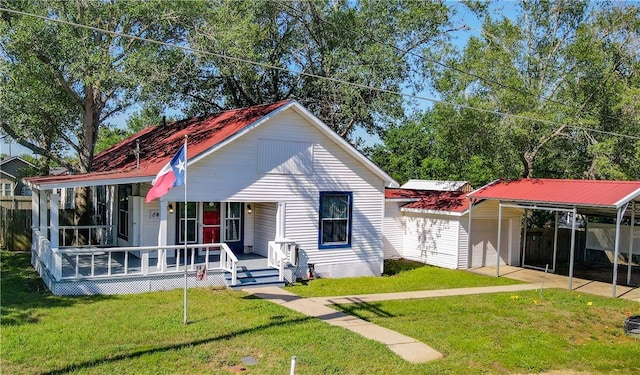 403N Banks St, Caldwell, TX 77836 - view of front of property with covered porch, a carport, and a front yard