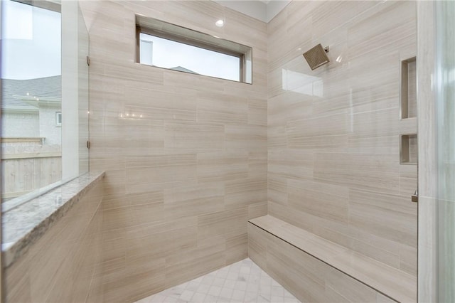 bathroom with a sauna and tiled shower