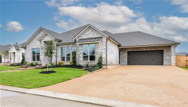 view of front facade with brick siding, an attached garage, concrete driveway, and a front lawn