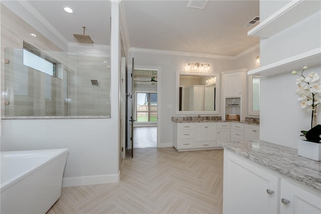 full bath featuring a stall shower, vanity, crown molding, and baseboards