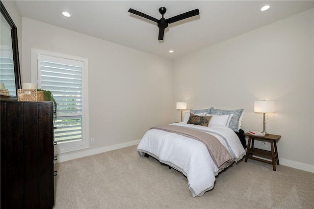 bedroom with ceiling fan, recessed lighting, baseboards, and light carpet