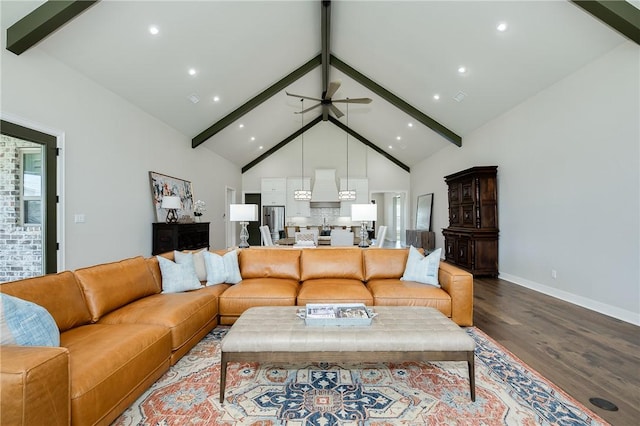 living room with beam ceiling, high vaulted ceiling, ceiling fan, and wood finished floors