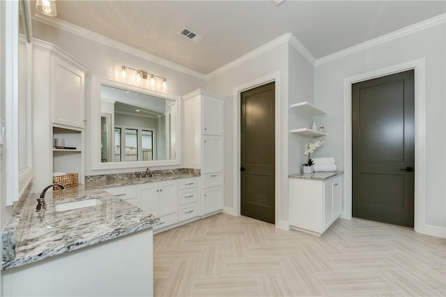 full bathroom featuring a sink, visible vents, two vanities, and crown molding