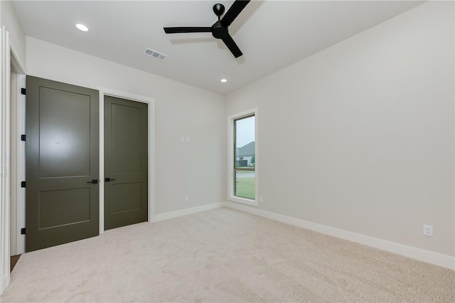 unfurnished bedroom with visible vents, recessed lighting, baseboards, and carpet