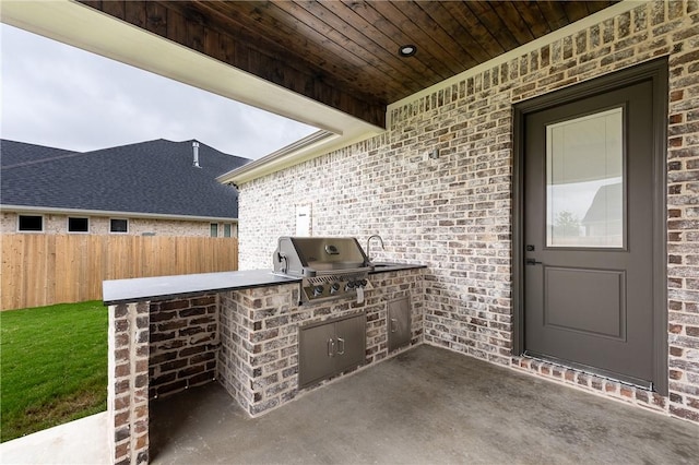 view of patio / terrace with grilling area, area for grilling, and fence