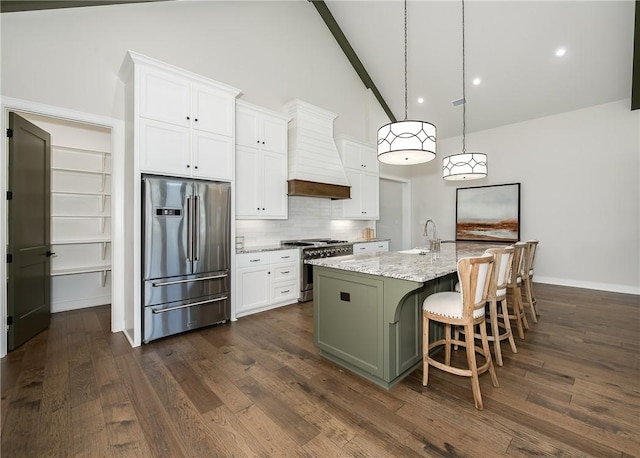 kitchen with white cabinetry, custom exhaust hood, high quality appliances, and tasteful backsplash