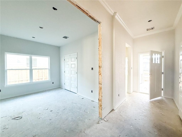 entrance foyer with visible vents, baseboards, and crown molding