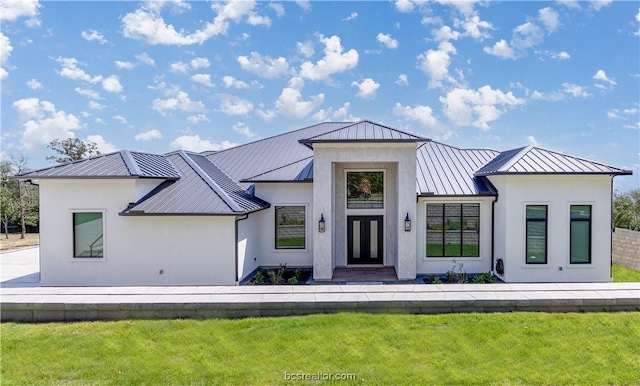 modern farmhouse style home with a front yard