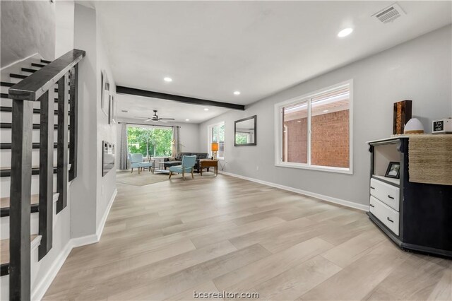 entrance foyer featuring light hardwood / wood-style flooring and ceiling fan