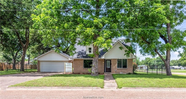 view of front of home with a garage and a front yard