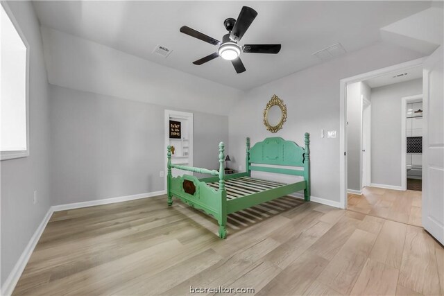 bedroom with light hardwood / wood-style flooring and ceiling fan