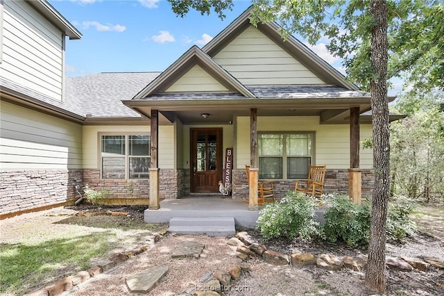 property entrance with covered porch