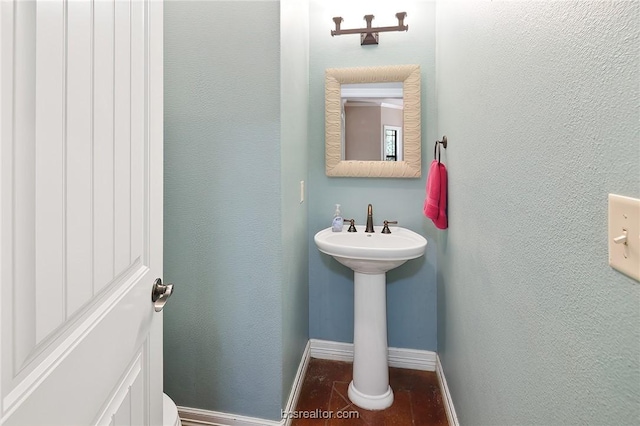 bathroom with hardwood / wood-style flooring