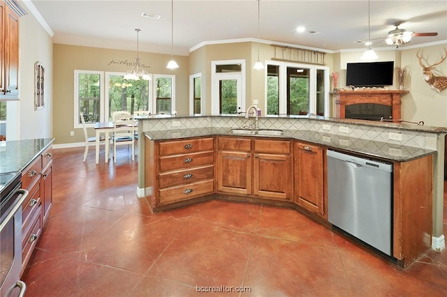 kitchen featuring appliances with stainless steel finishes, pendant lighting, sink, backsplash, and ornamental molding