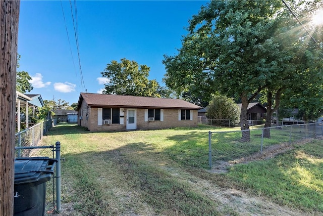 single story home featuring a front yard