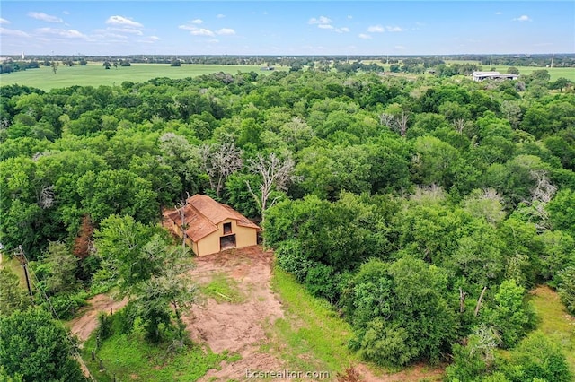 birds eye view of property with a rural view