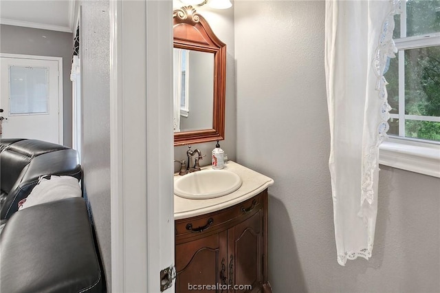 bathroom featuring vanity and crown molding