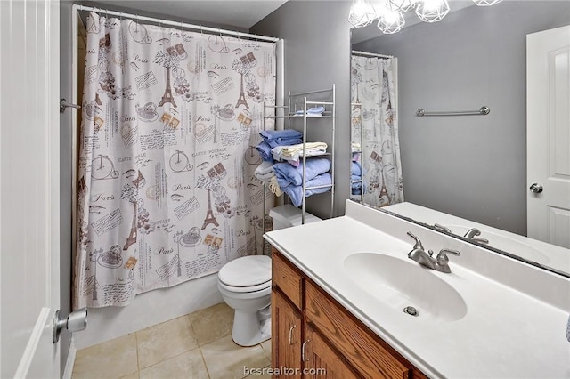 full bathroom featuring tile patterned floors, vanity, toilet, and shower / bath combo with shower curtain