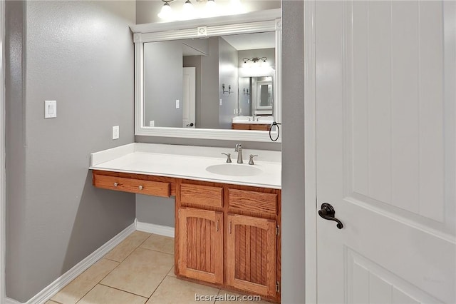 bathroom with tile patterned floors and vanity