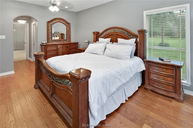 bedroom with ceiling fan and light hardwood / wood-style floors