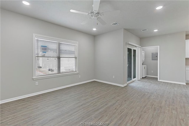 empty room with light hardwood / wood-style flooring and ceiling fan