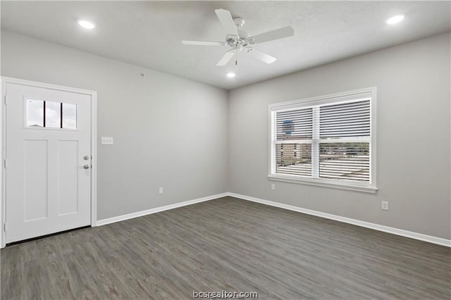 entryway with ceiling fan and dark hardwood / wood-style flooring