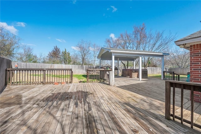 deck featuring a hot tub