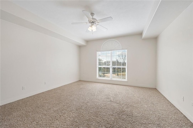 carpeted empty room featuring ceiling fan