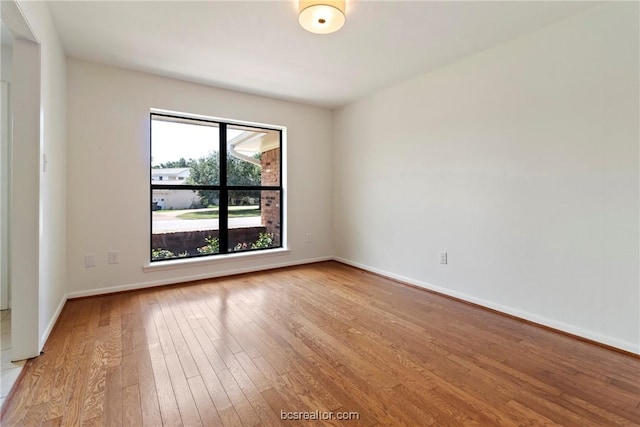 unfurnished room with light hardwood / wood-style flooring