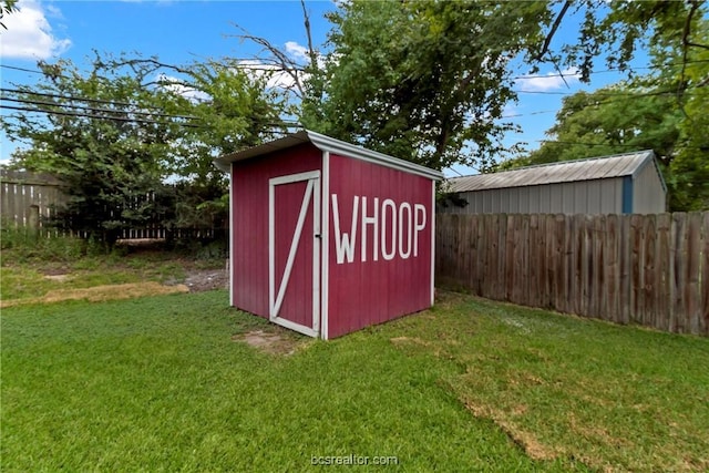 view of outdoor structure with a lawn