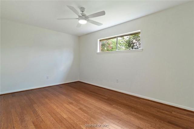 spare room featuring ceiling fan and hardwood / wood-style flooring