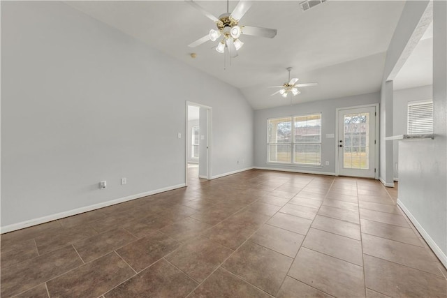 spare room featuring lofted ceiling, tile patterned flooring, and ceiling fan