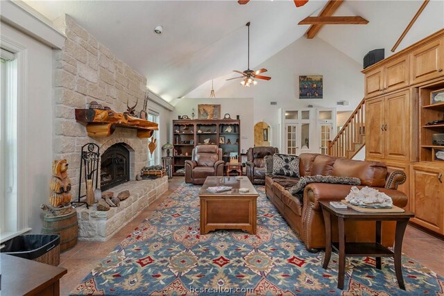 living room with light tile patterned flooring, high vaulted ceiling, a fireplace, ceiling fan, and beam ceiling