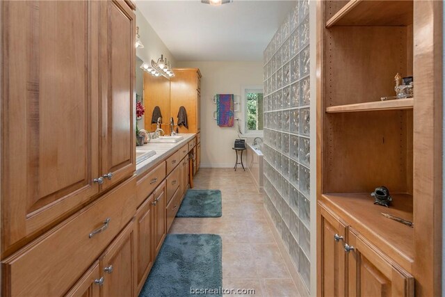 bathroom with tile patterned flooring and vanity