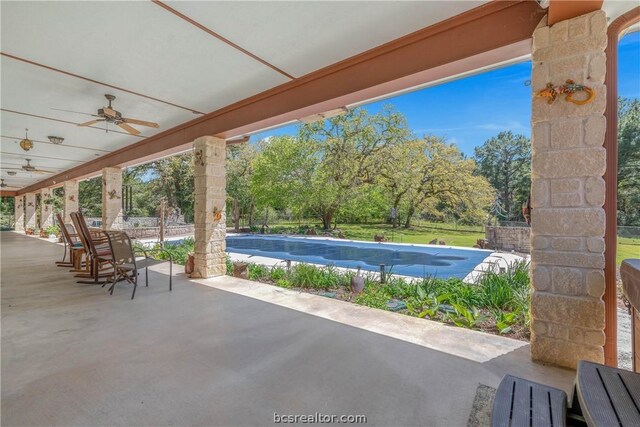 view of pool with a patio area and ceiling fan