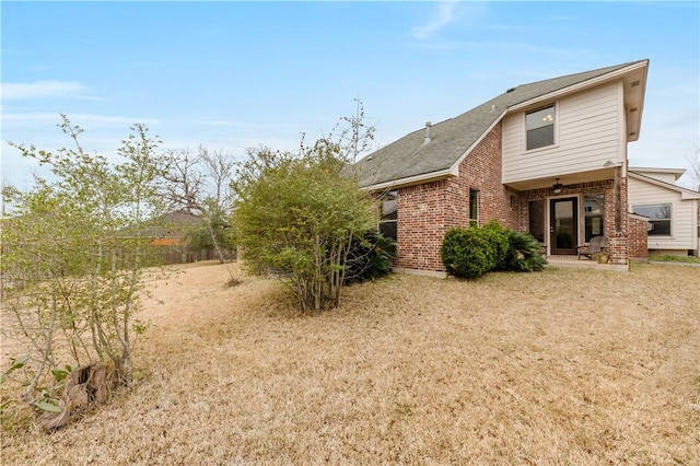 back of house with a yard and a patio area