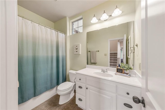 full bathroom with tile patterned flooring, vanity, shower / bath combo, and toilet