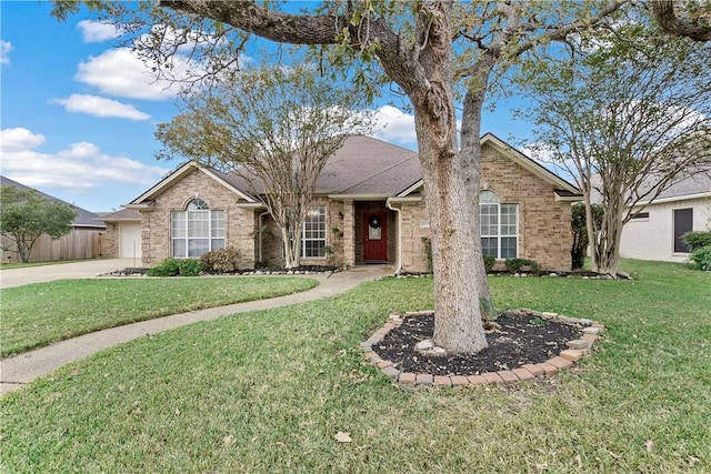 single story home featuring a garage and a front yard