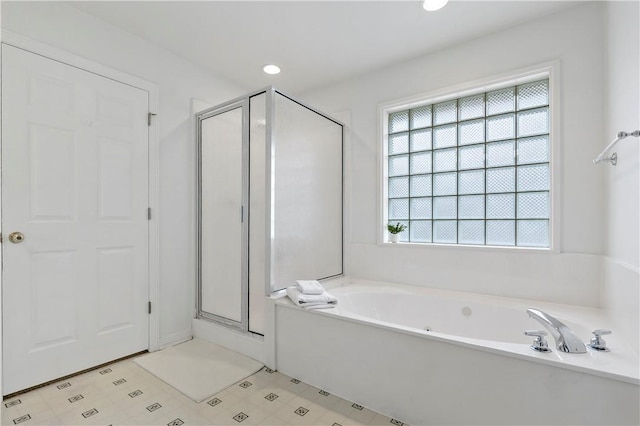 bathroom featuring plus walk in shower