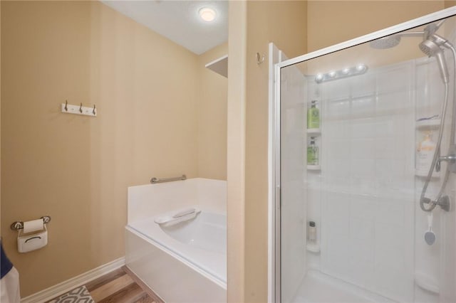 1610 Ethic Ln, College Station, TX 77845 - bathroom with a stall shower, a garden tub, and baseboards