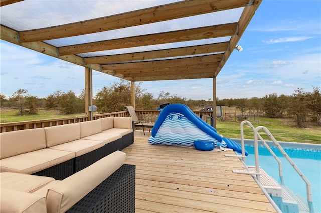 wooden deck featuring outdoor lounge area and an outdoor pool