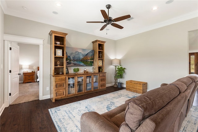 living area featuring ornamental molding, baseboards, and dark wood-style floors