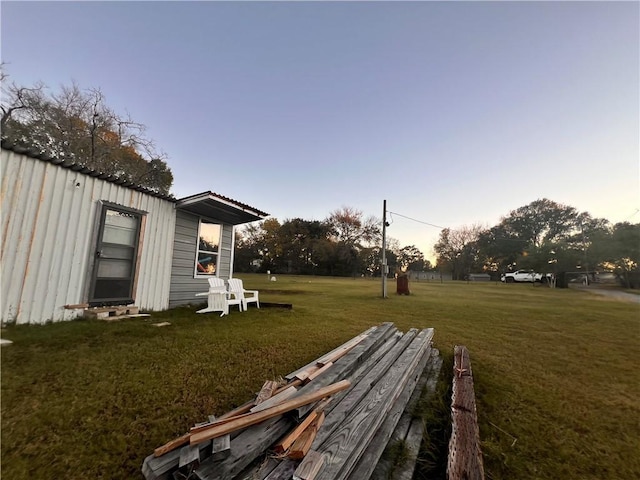 view of yard at dusk