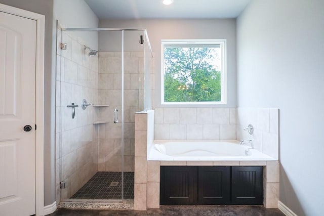 12029 Eagle Ln, North Zulch, TX 77872 - full bathroom featuring a bath, a stall shower, and recessed lighting